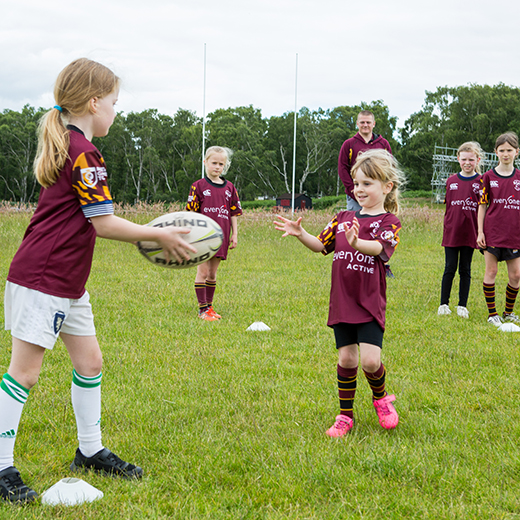 girls playing rugby for commercial photography at Ampthill Rugby Club 
