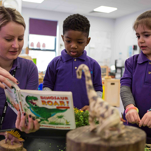 pre school children looking at  book for marketing photography
