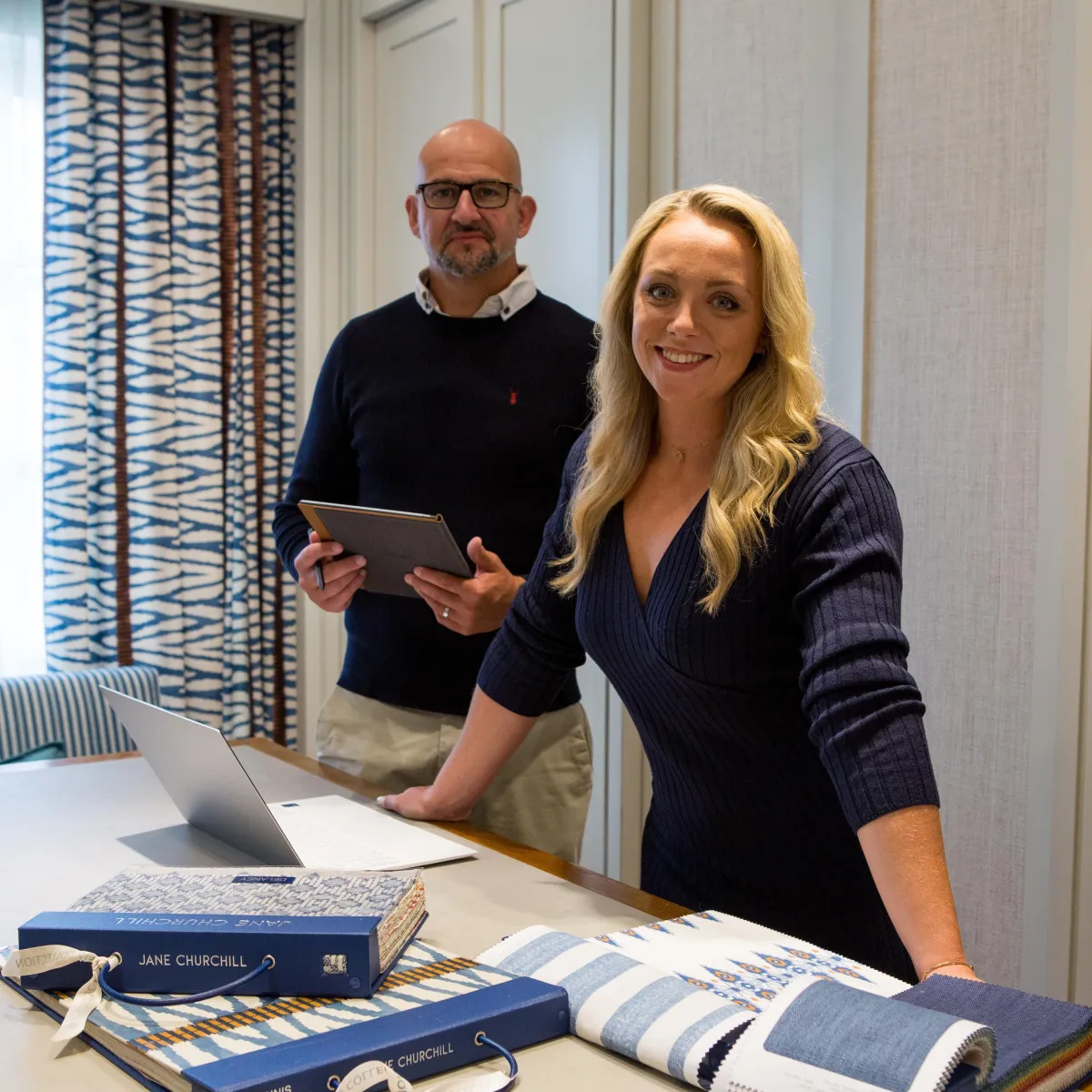 Branding photography for interior design company in London Man and women with samples