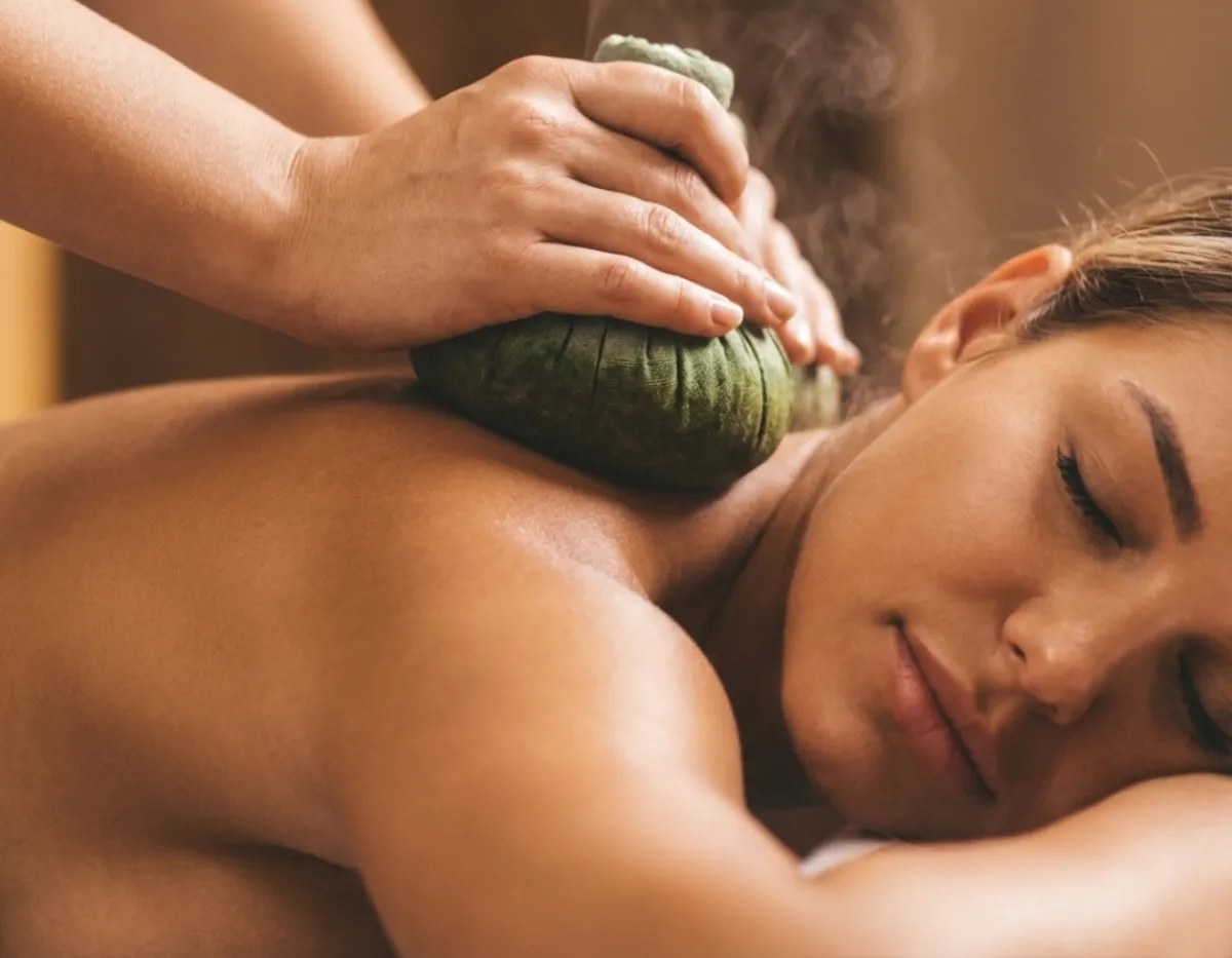 Thai herbal compress massage add on in Houston using warm herbal balls