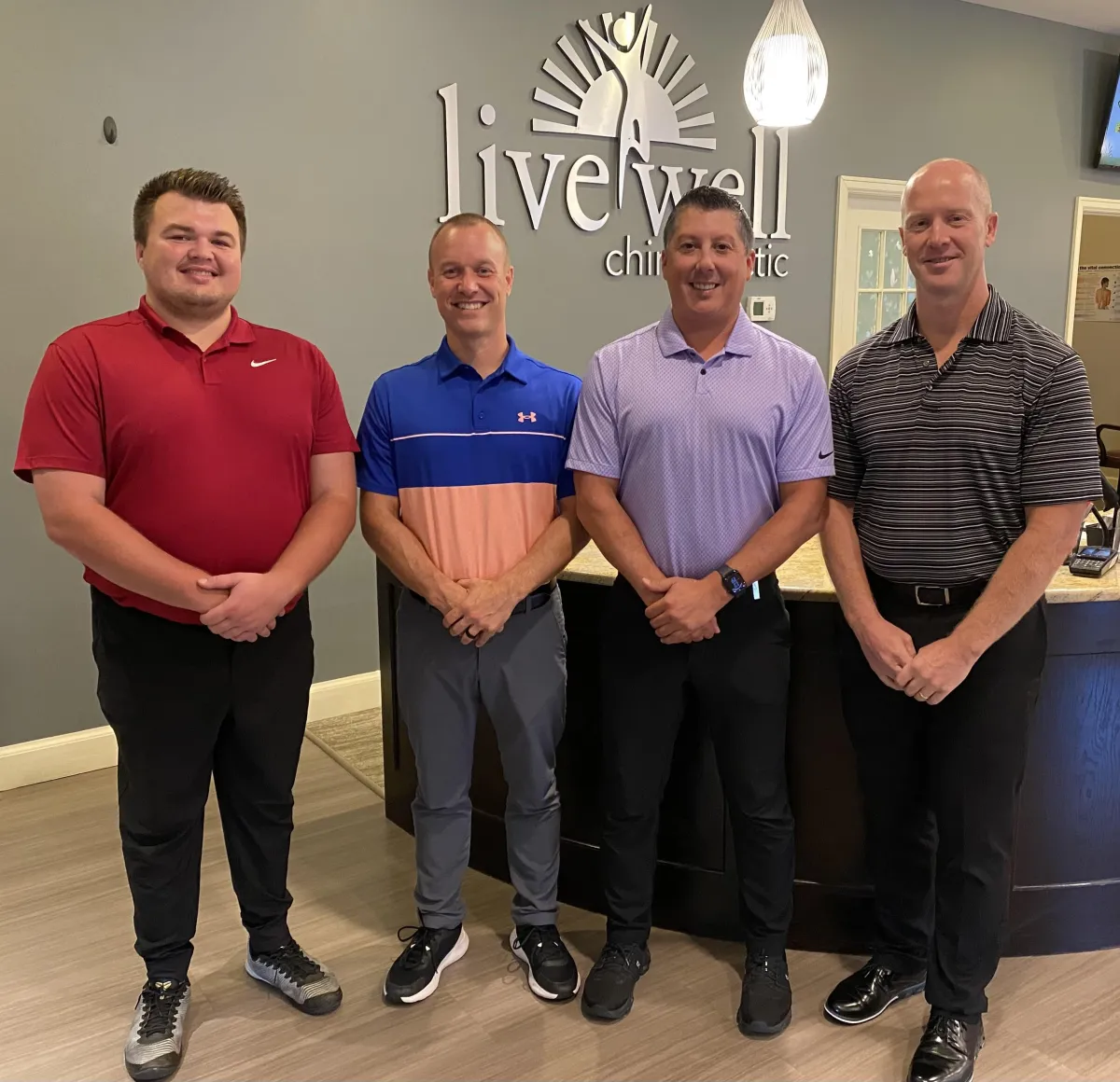 brown rattan swing bench with cushions