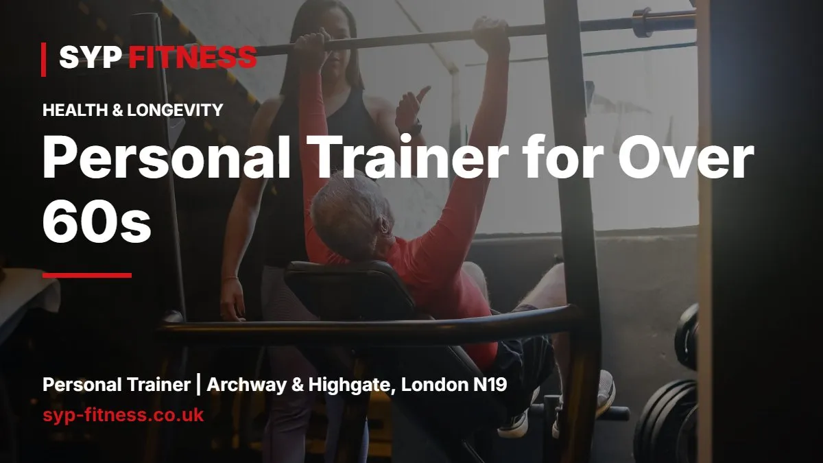 Older man practising sit-to-stand from a chair with a trainer beside him in a bright studio - Personal Trainer for Over 60s: Stay Strong and Steady, SYP Fitness personal trainer Archway N19