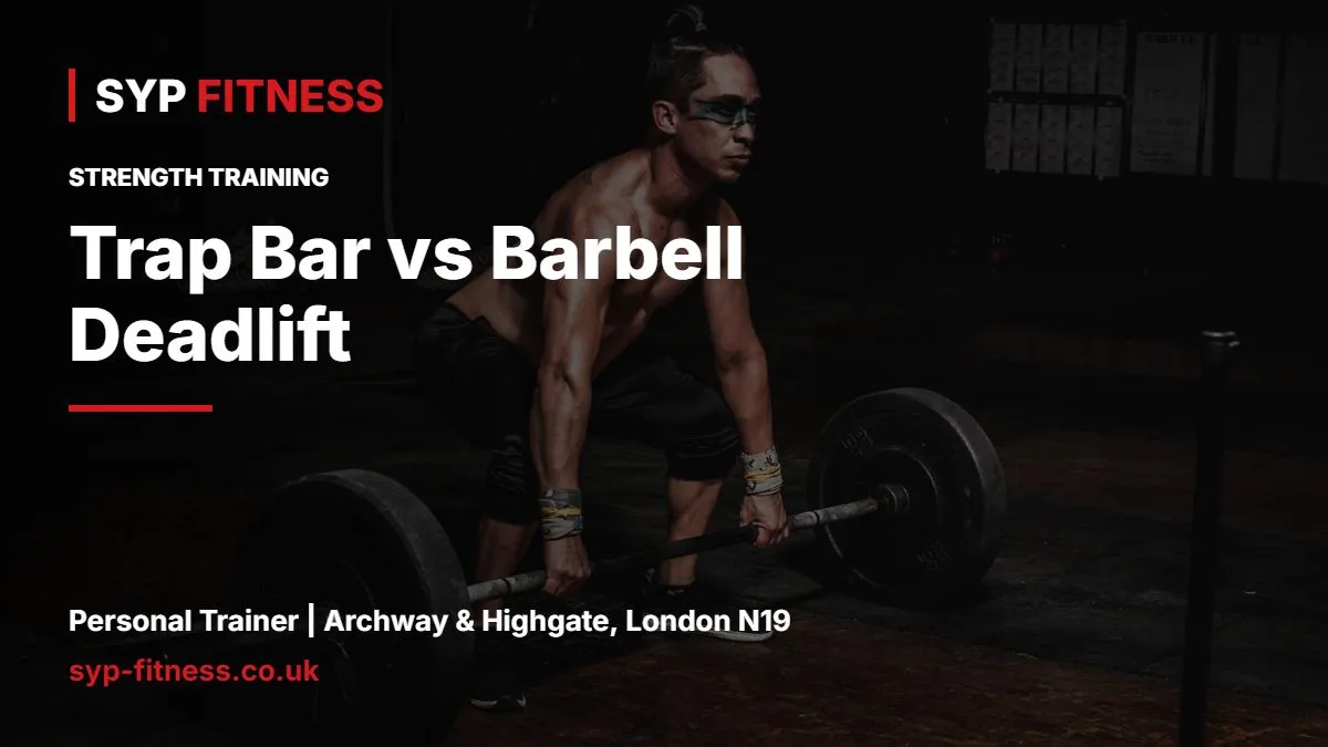 Man lifting a heavy barbell in a dark gym - Trap Bar vs Barbell Deadlift: Which Should You Choose?, SYP Fitness personal trainer Archway N19