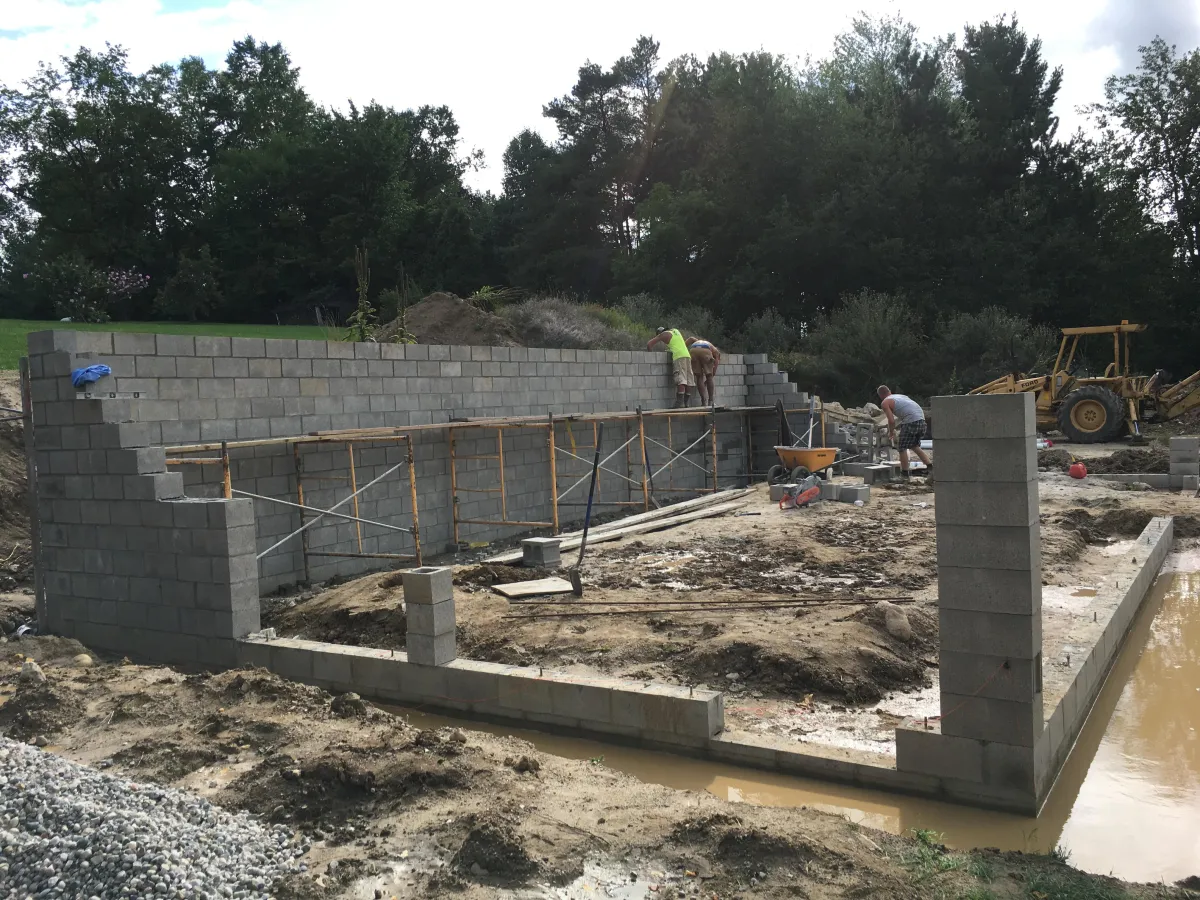Concrete footings, cmu block wall foundation for basement. 