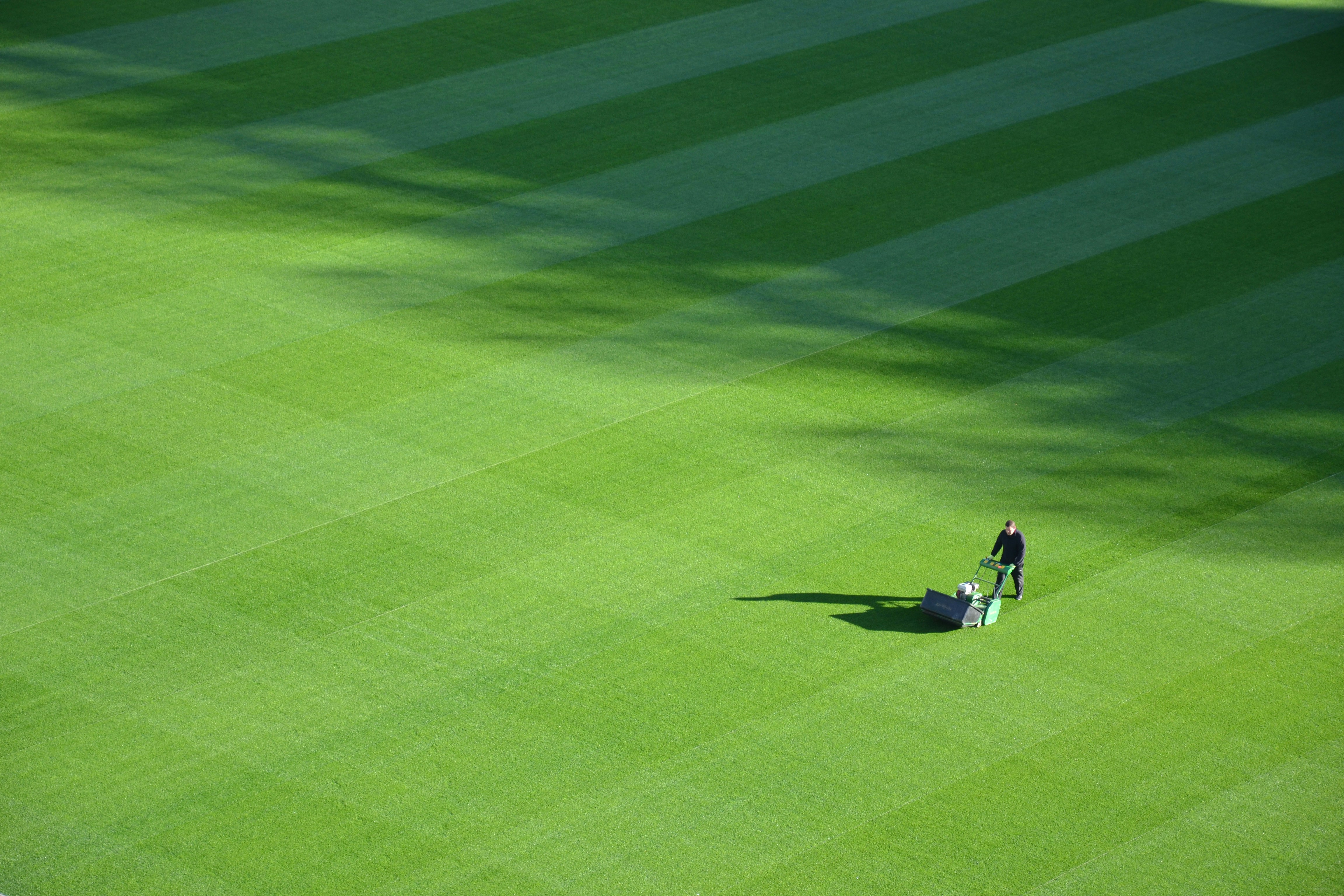 guy mowing a football field
