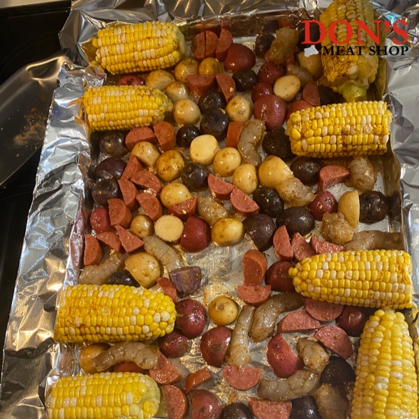 oven bake with corn on the cob, sausage, potatos and shrimp