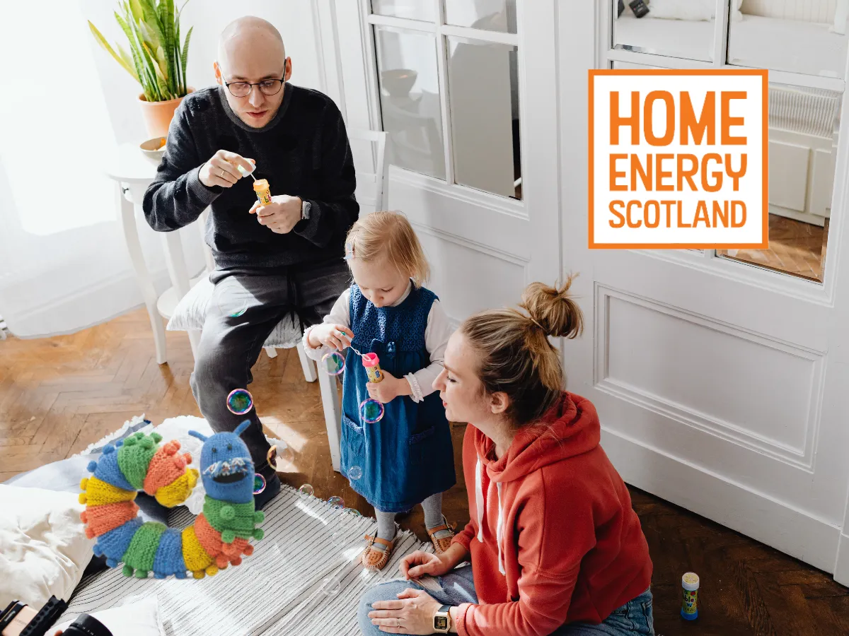 Home Energy Scotland insulation funding - installer fitting insulation in a Scottish home