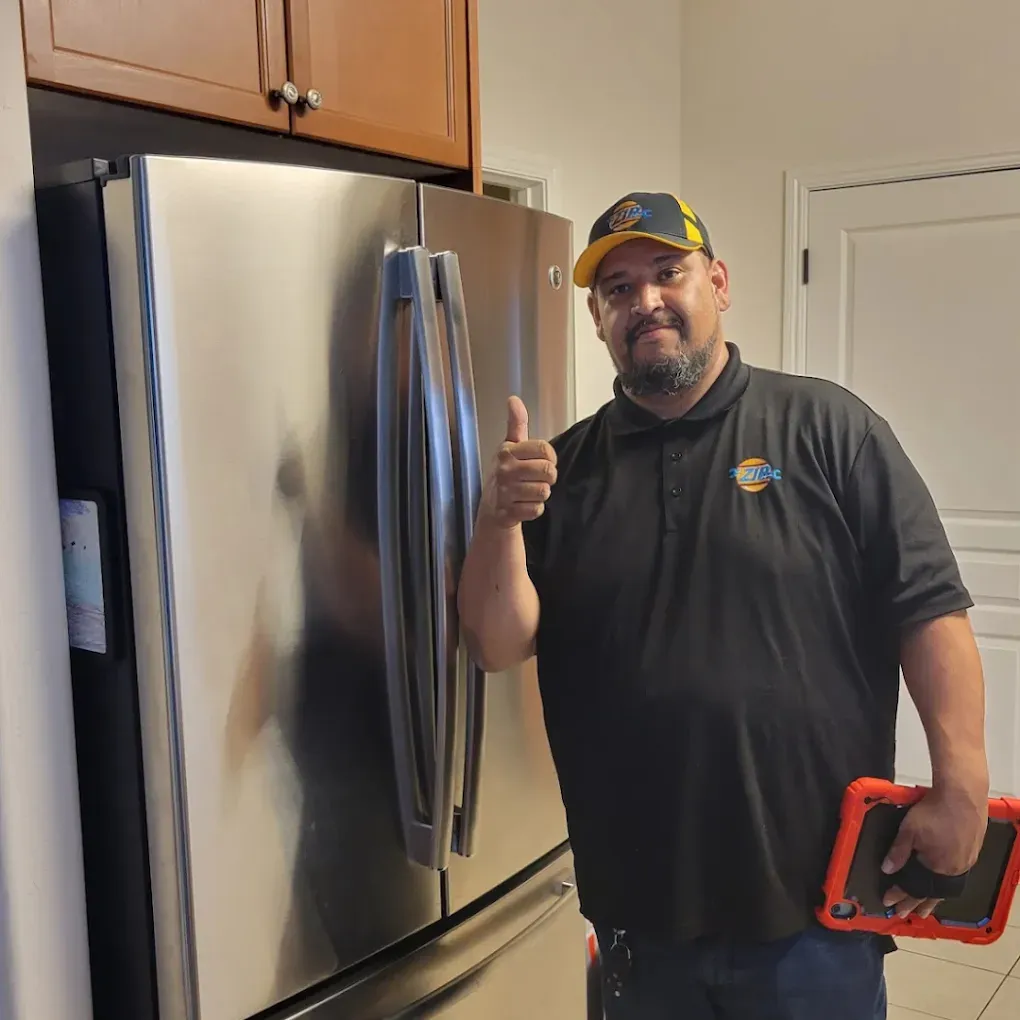 A certified appliance technician capturing a digital diagnostic video of a worn component inside a kitchen unit in Fresno, CA near the River Park shopping district.
