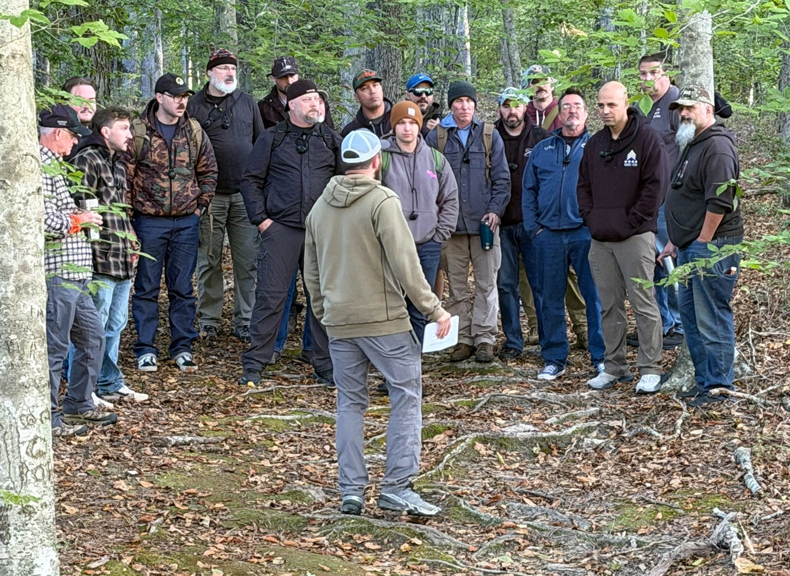 Mentor teaching boys and dads