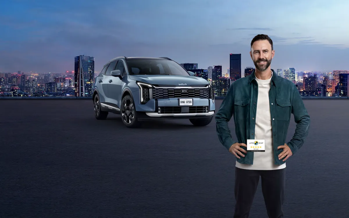 white porsche 911 parked in front of building