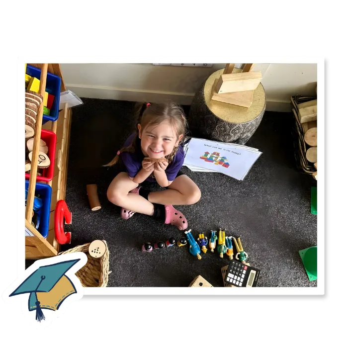 Smiling child enjoying hands-on learning at Curious Minds childcare academy in Winter Garden, Florida