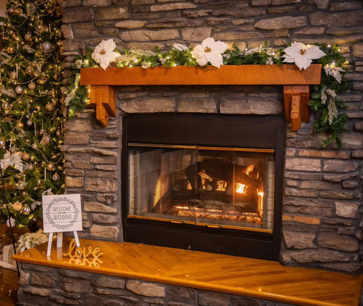 omantic sweetheart table at Morningside Inn set for two with gold chargers, fresh salads, floral garland, and candlelight accents