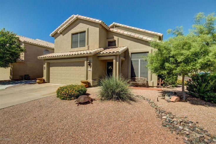 gray couch beside green potted plant