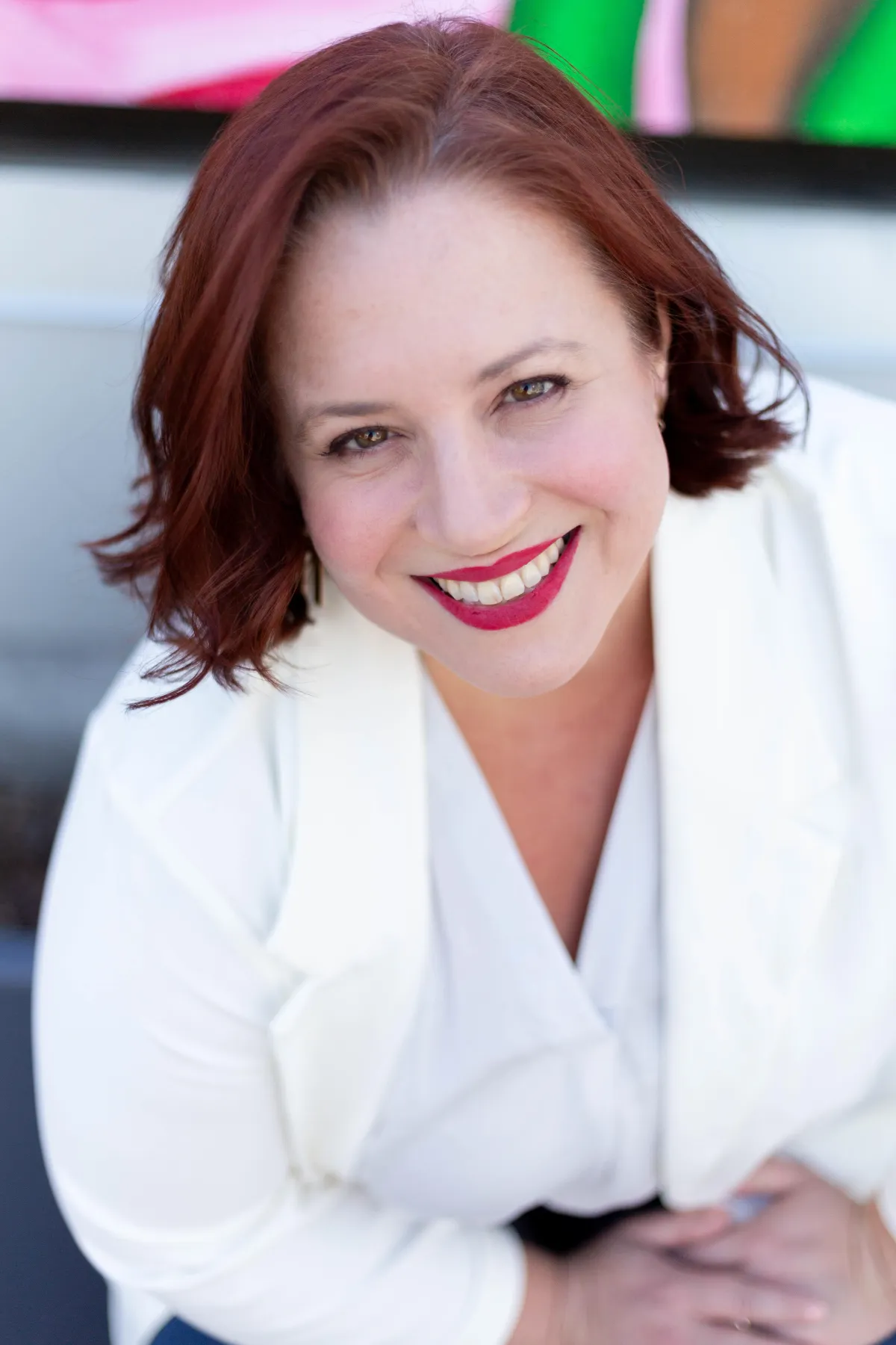 Professional headshot of Mary Czarnecki, strategic storytelling expert and workshop facilitator, smiling confidently with a softly blurred background.