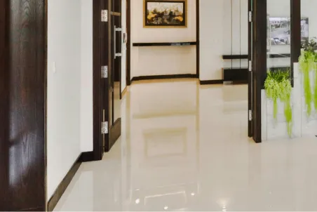 A close up of a rug on a wooden floor