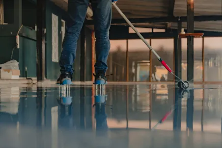 person walking on concrete pavement