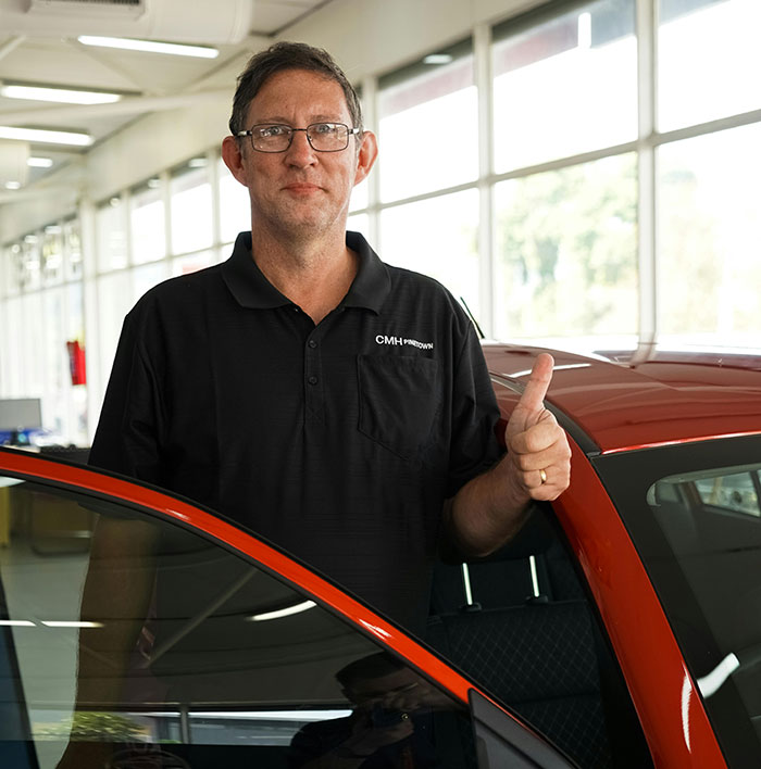 Happy customer receiving keys to their newly financed vehicle through Drive Access