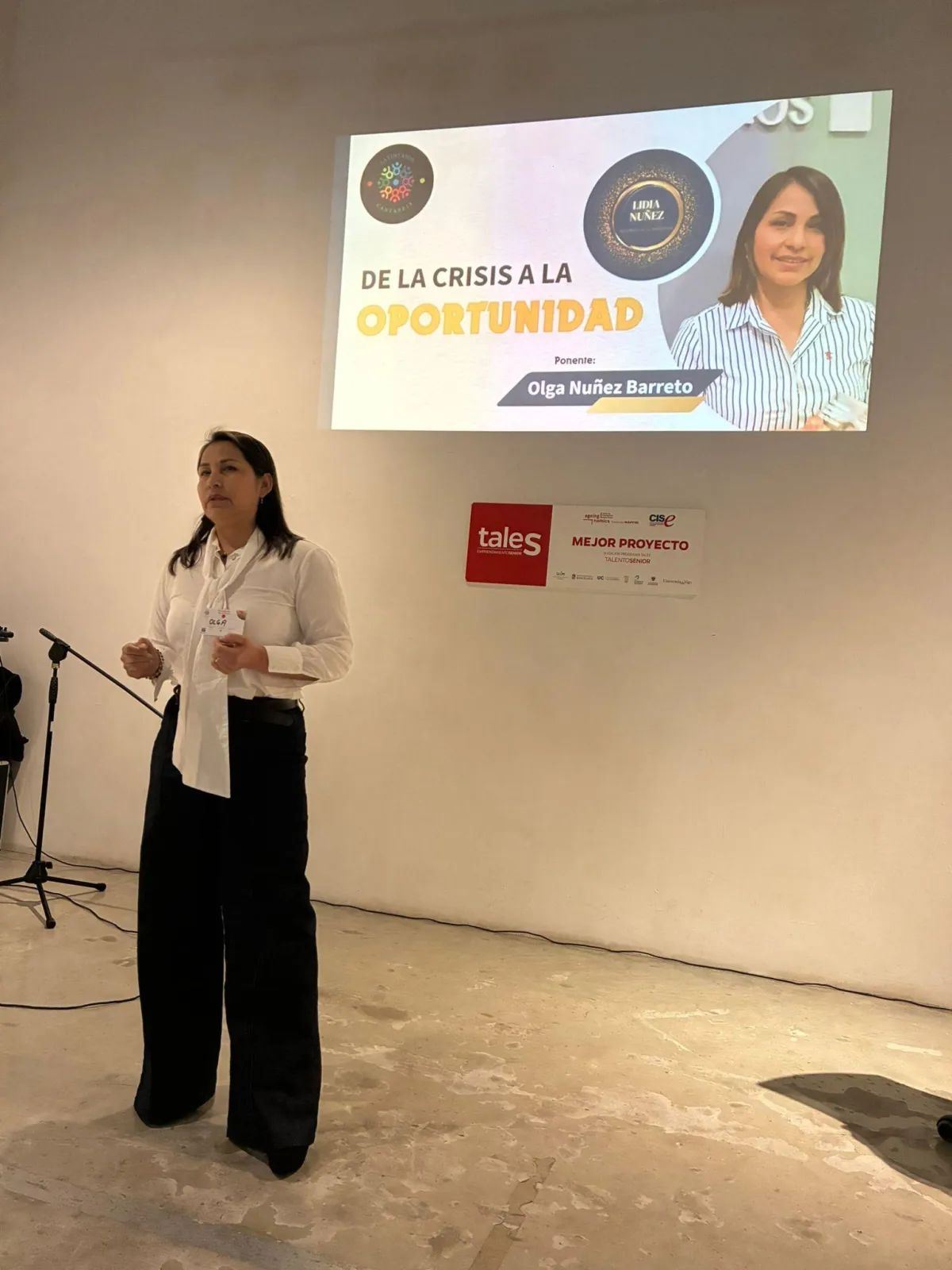 a person holding a small white bird in their hands