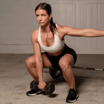 Utah County Strength Trainer Holly Jimenez squat lifting a dumbbell