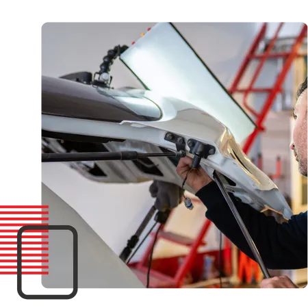 A+ Dent Medic Repair Technicians repairing car dents