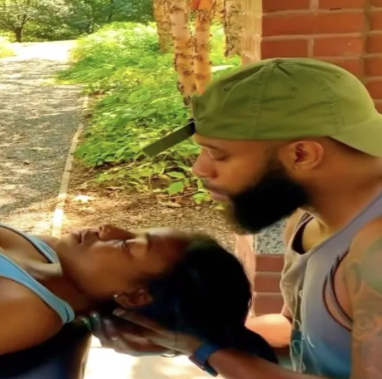 Woman stretching on yoga mat in autumn park