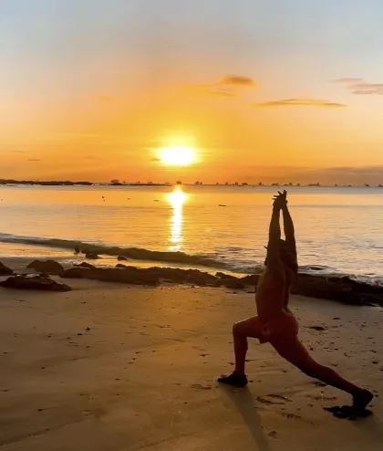 woman performing yoga during daytime