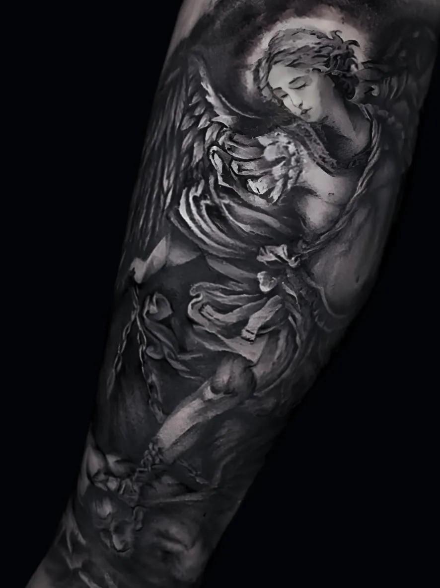 St. Michael the Archangel tattoo in black & gray realism — divine composition symbolizing protection & strength. By Alek the Saint, San Diego.