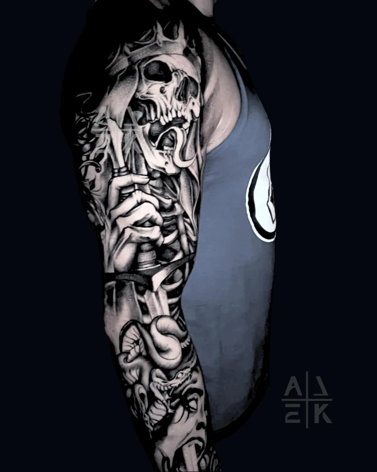 Blackwork sleeve tattoo of the Lich King’s sword piercing Medusa, featuring skulls and fantasy realism by Alek the Saint, Point Loma, San Diego.