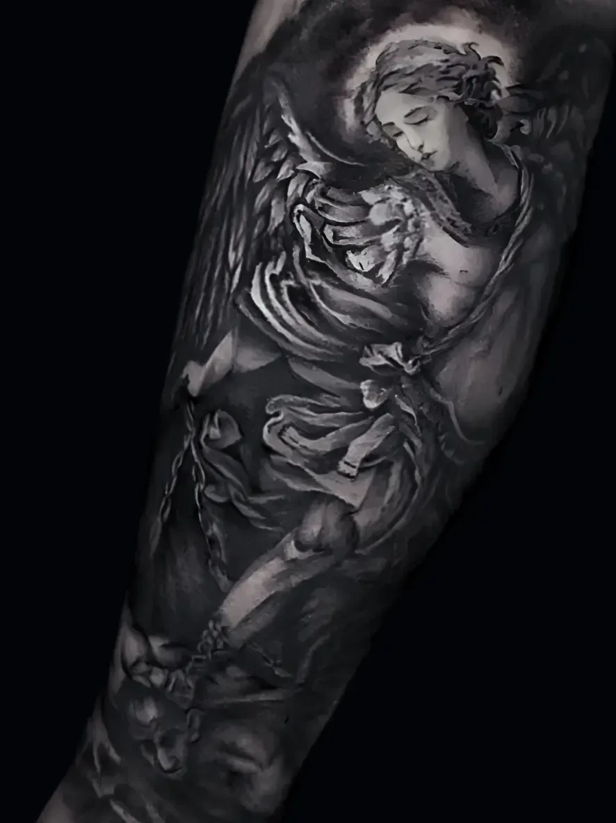 St. Michael the Archangel tattoo in black & gray realism — divine composition symbolizing protection & strength. By Alek the Saint, Oceanside, Ca