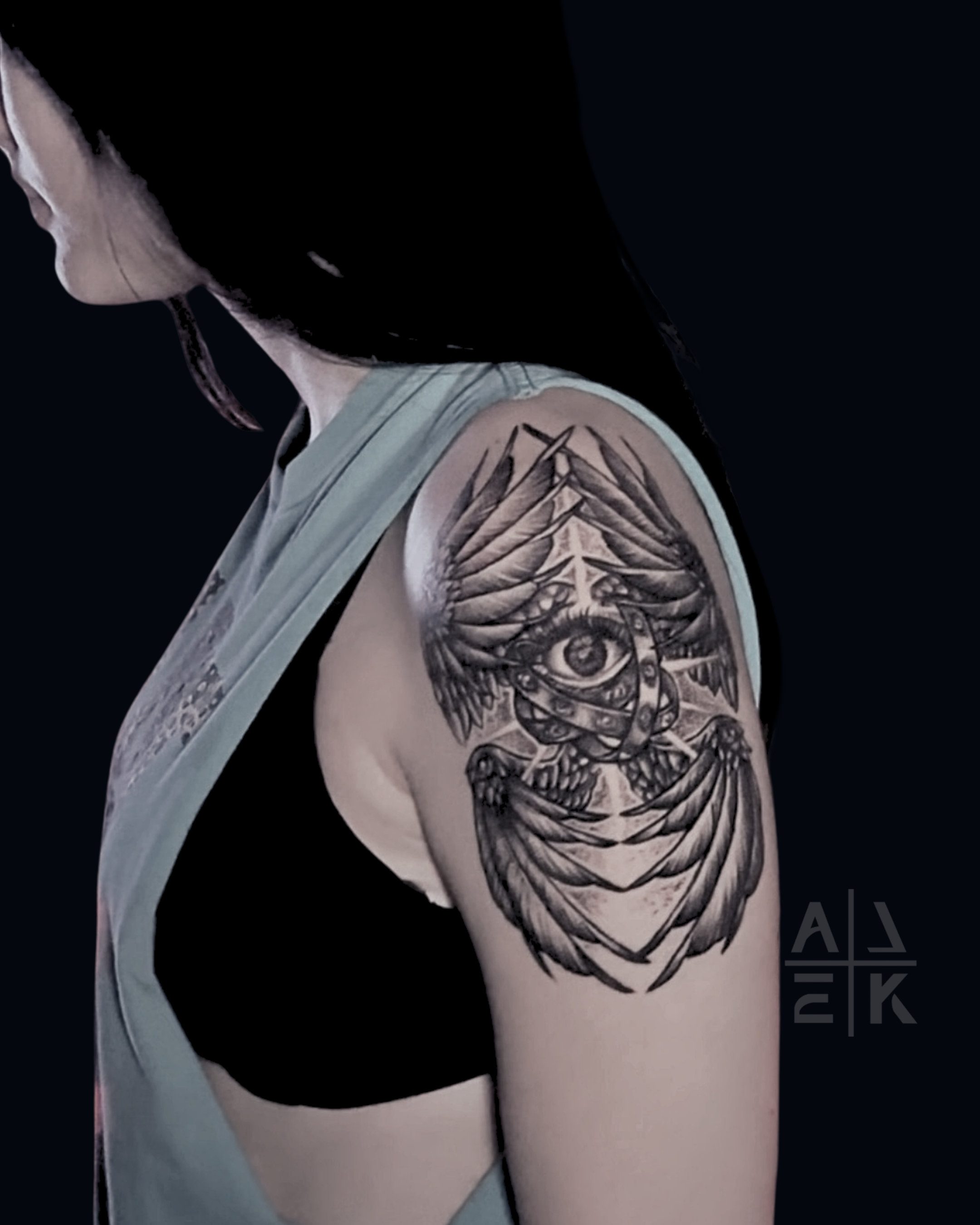 “Blackwork floral thigh tattoo with whip shading, featuring bold flowers and smooth gradients by Alek the Saint, Oceanside, Ca”