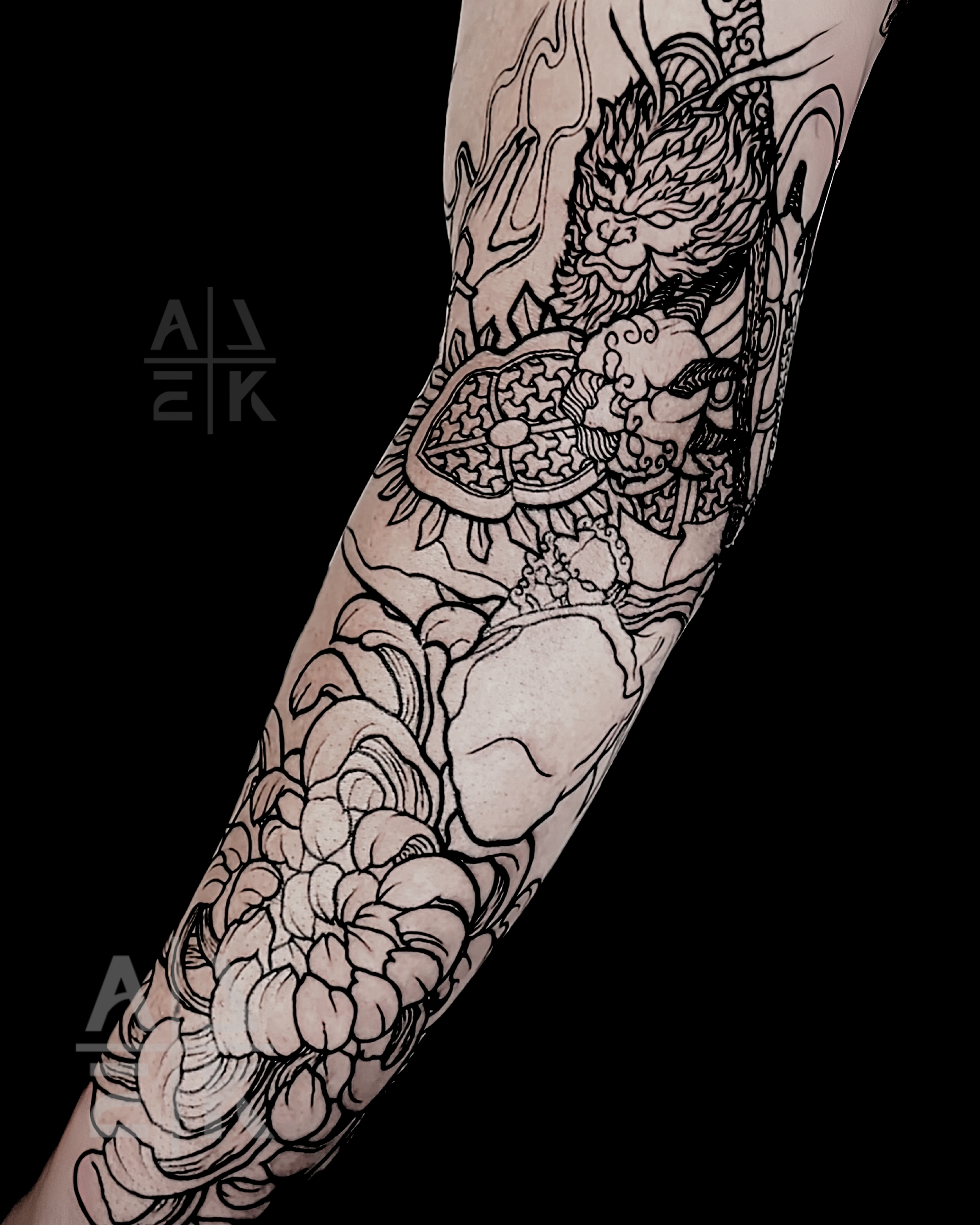 Blackwork sleeve tattoo of the Lich King’s sword piercing Medusa, featuring skulls and fantasy realism by Alek the Saint, Oceanside, Ca