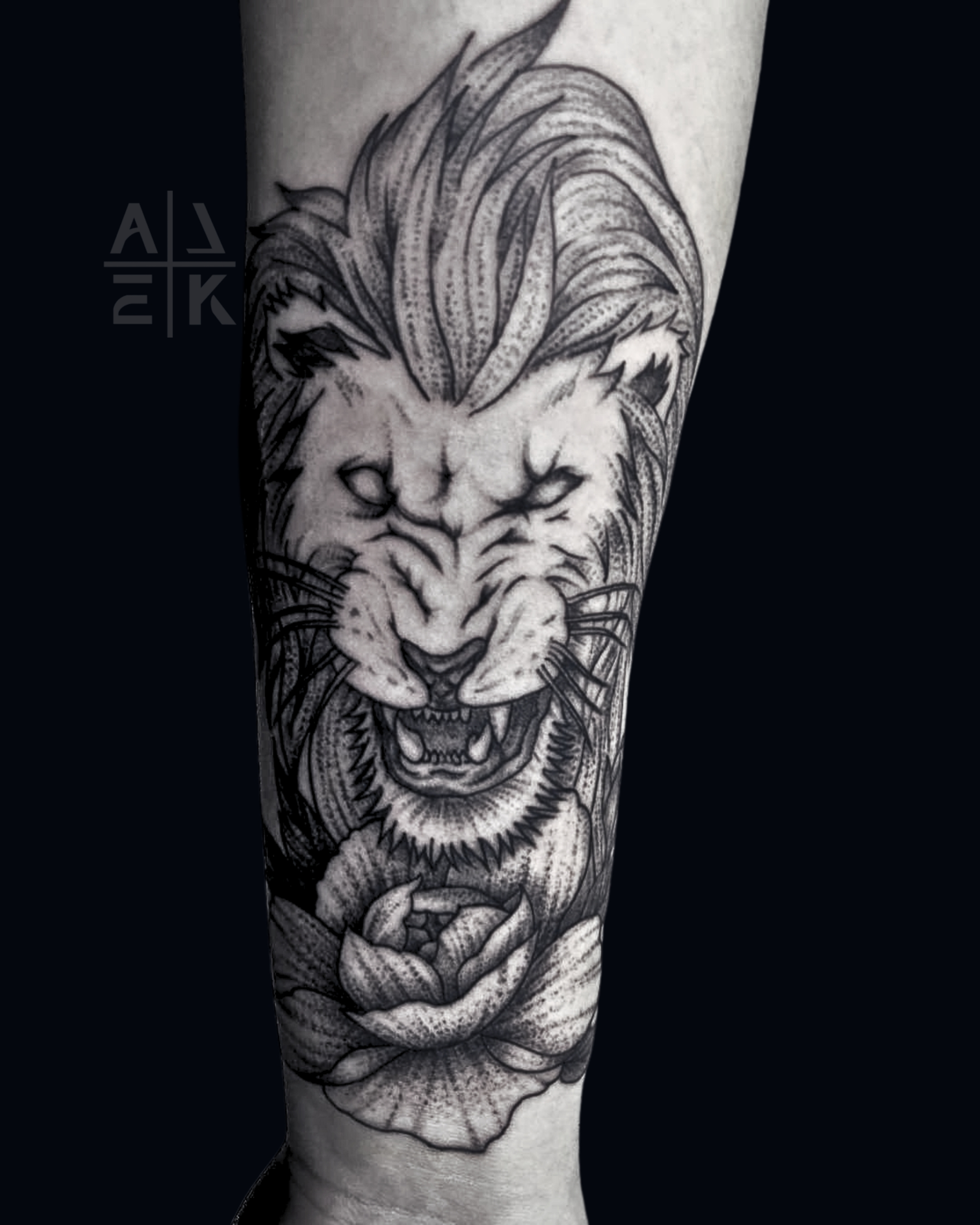 “Blackwork floral thigh tattoo with whip shading, featuring bold flowers and smooth gradients by Alek the Saint, Oceanside, Ca”