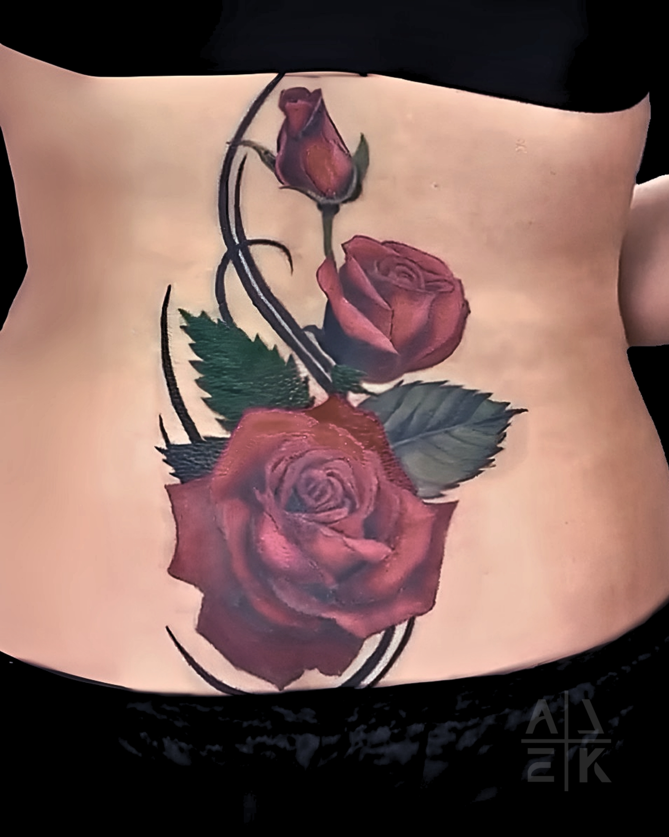 Sunflower shoulder tattoo in hyper-realism with bold outline and graphic linework leaves, covering unicorn tattoo. By Alek the Saint, Oceanside, Ca