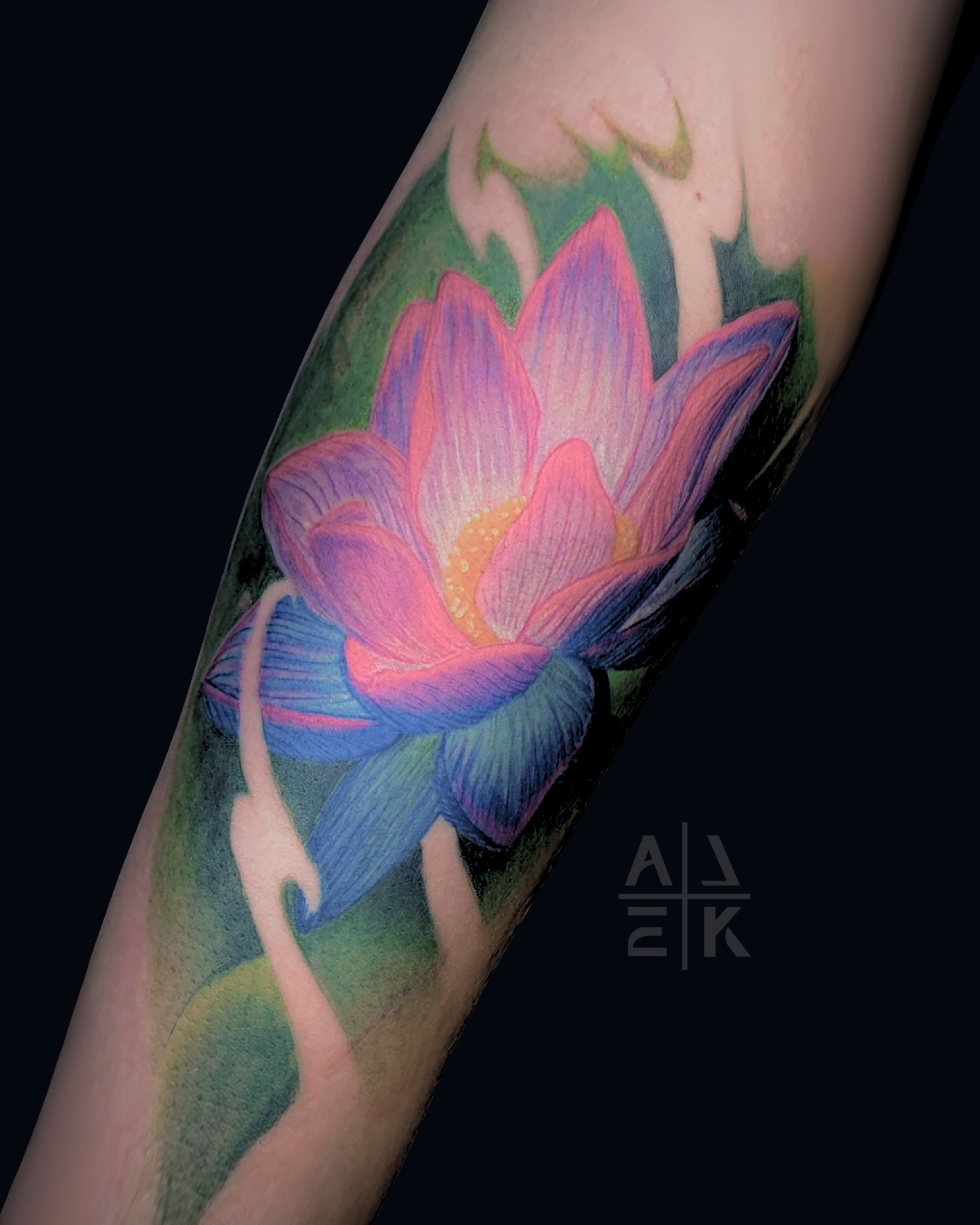 Realistic pink rose tattoo with smooth gray shading and clean edges — color realism by Alek the Saint in Oceanside, Ca