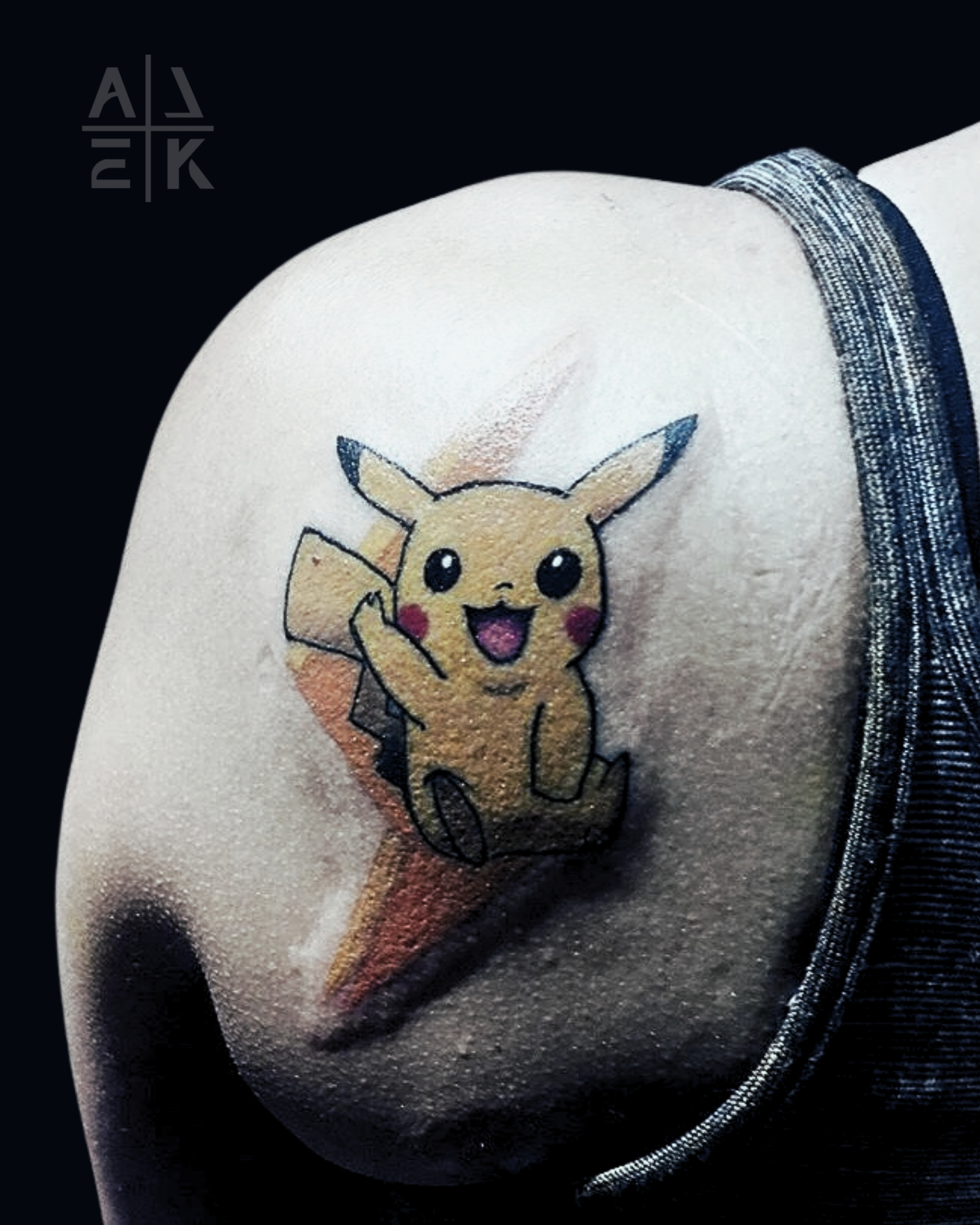 Color realism flower shoulder tattoo with bold black outlines and blackwork shading, created by Alek the Saint in Oceanside, Ca