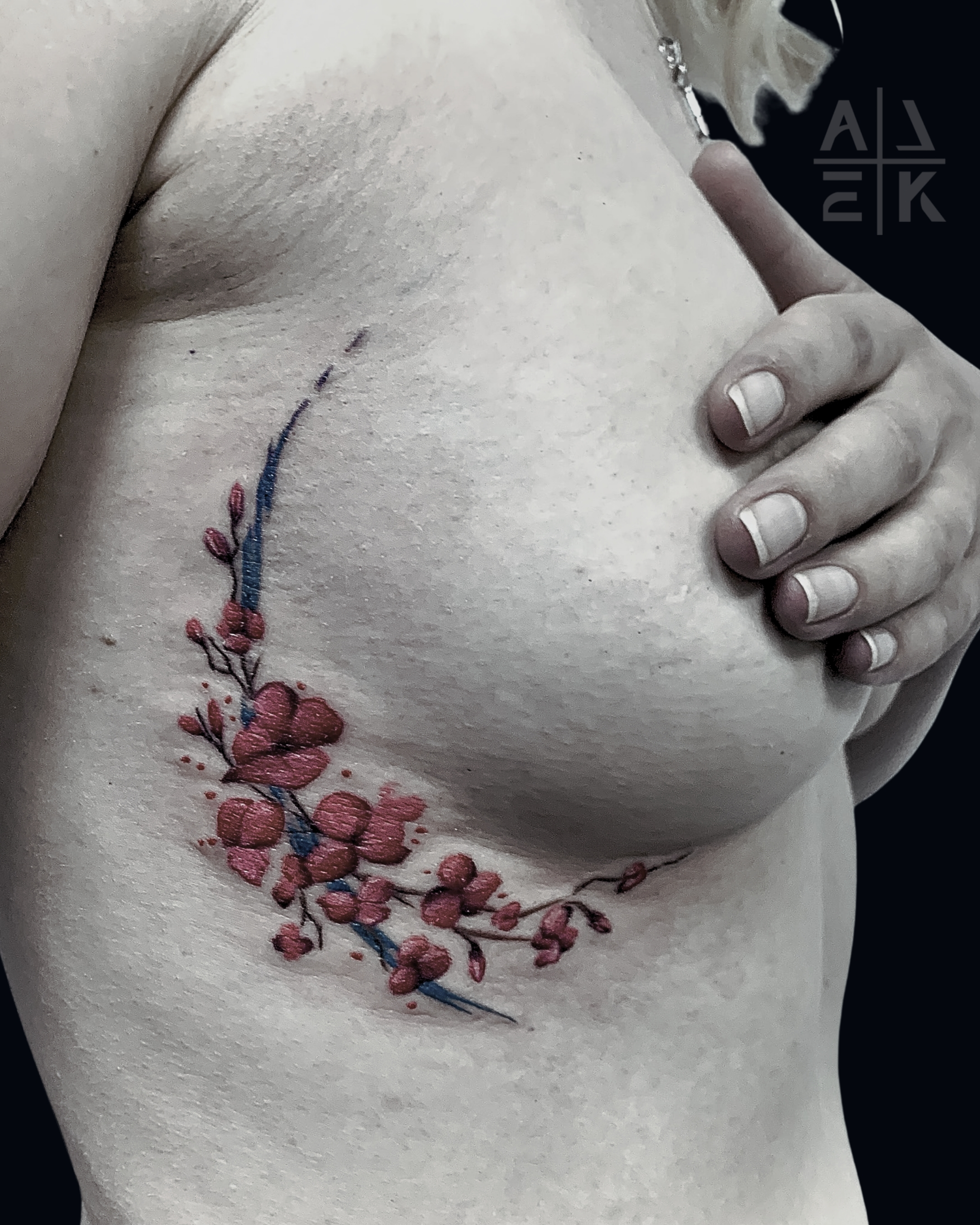 Realistic pink rose tattoo with smooth gray shading and clean edges — color realism by Alek the Saint in Oceanside, Ca