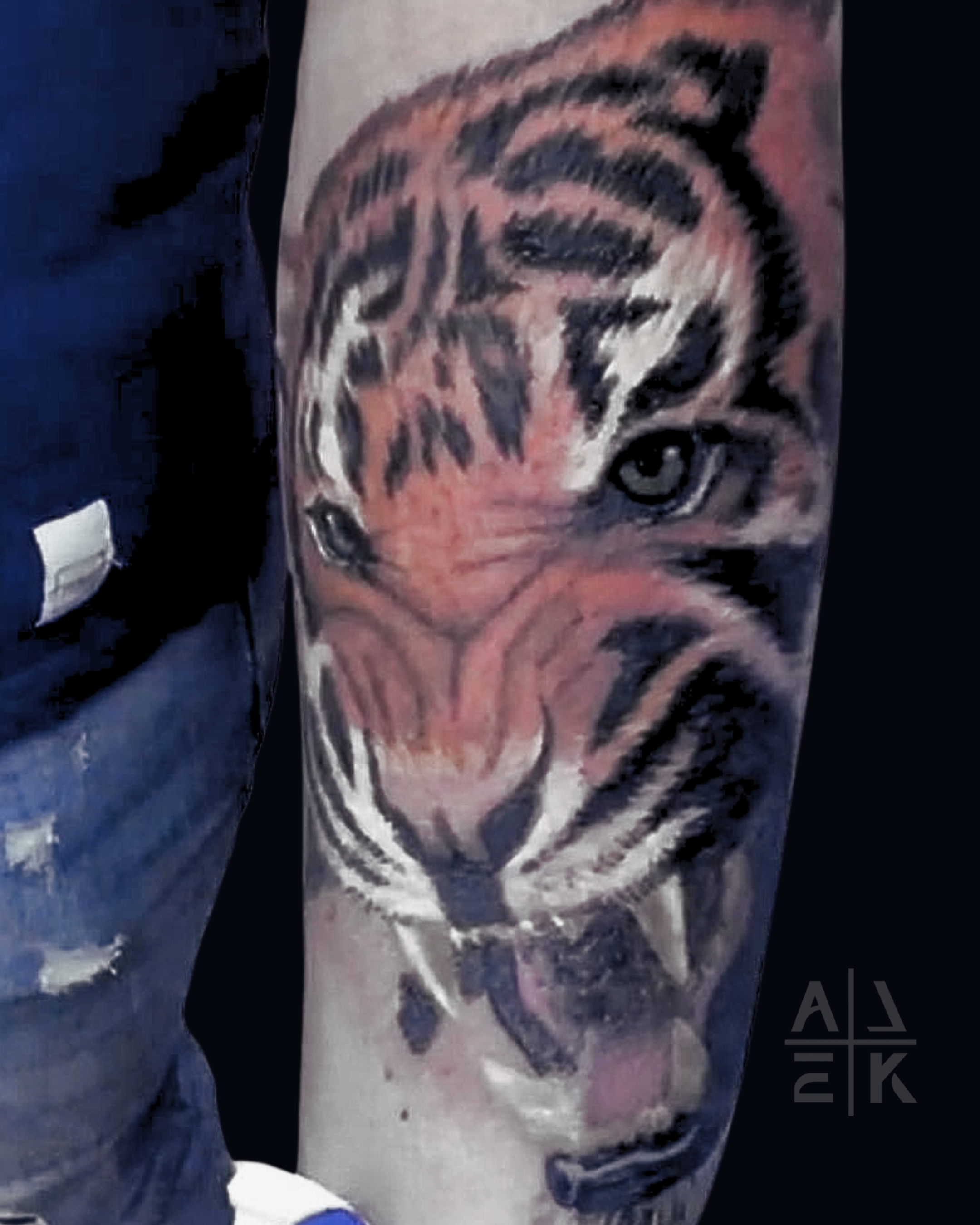 Color realism flower shoulder tattoo with bold black outlines and blackwork shading, created by Alek the Saint in Oceanside, Ca