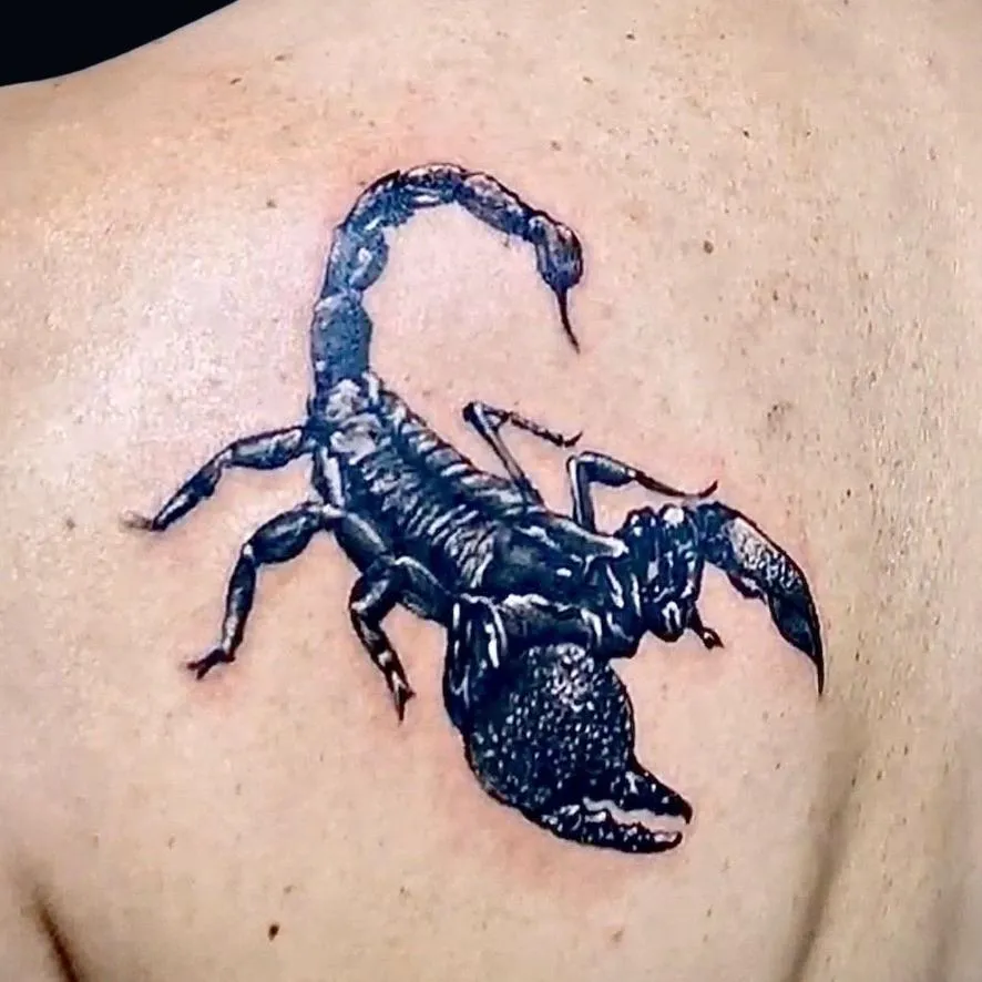 blackwork, scorpion tattoo on the shoulder plate in Oceanside, California