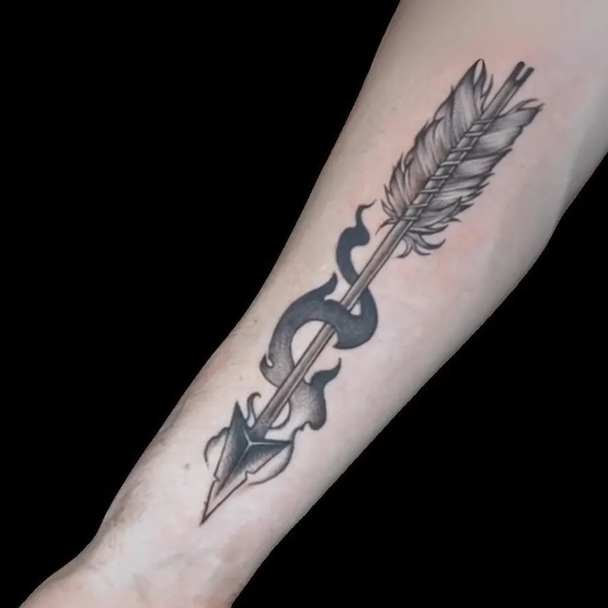blackwork tattoo of an arrow on the forearm in Oceanside, California