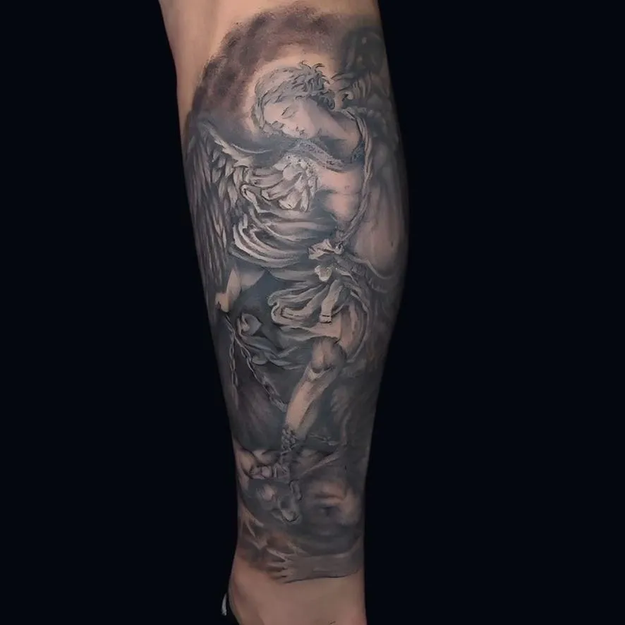 , black and gray calf tattoo of Saint Michael done in Oceanside, California