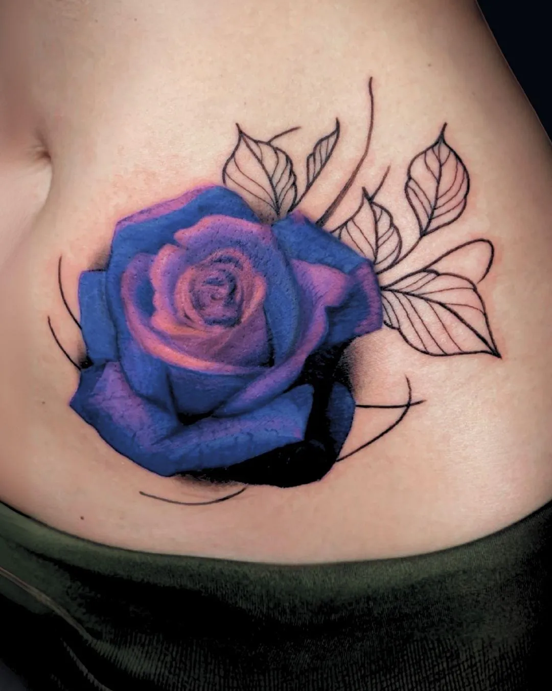 realism, blue, and purple tattoo, cover-up of initials in Oceanside, California done by the saint