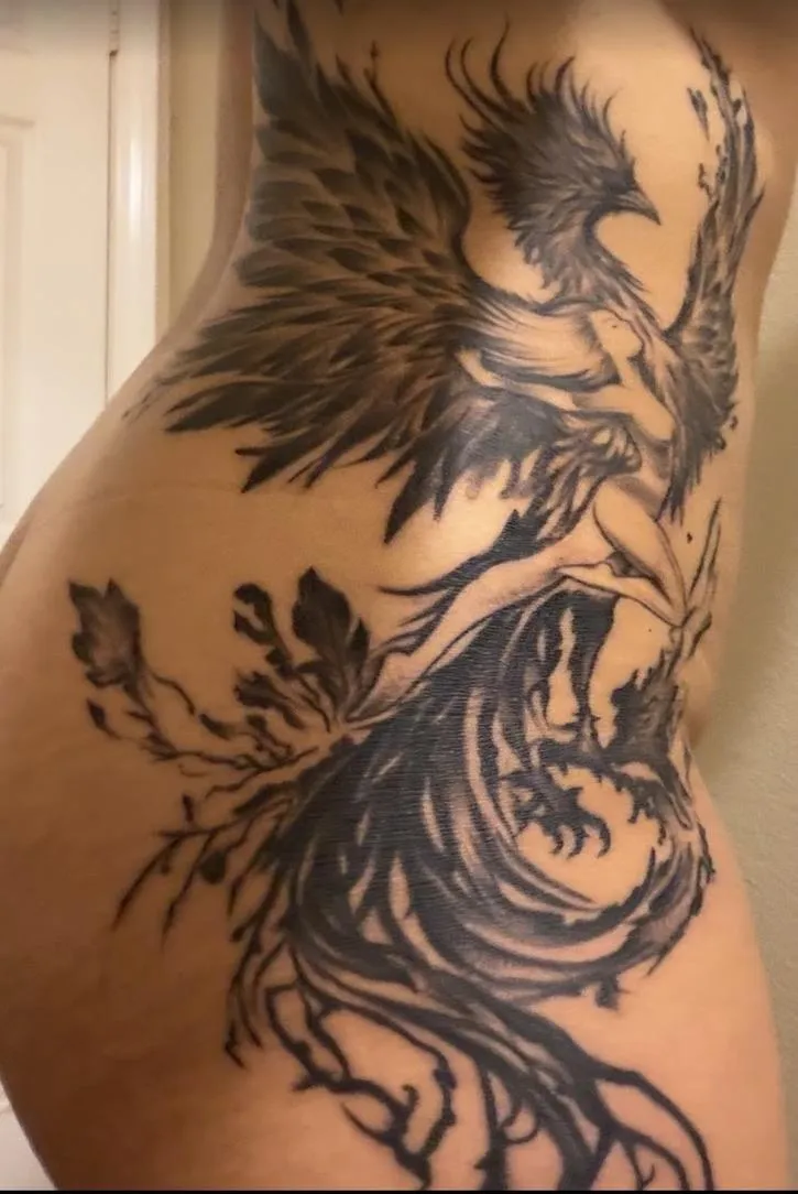a black work tattoo of a Phoenix on the whole side of the body done in Oceanside, California