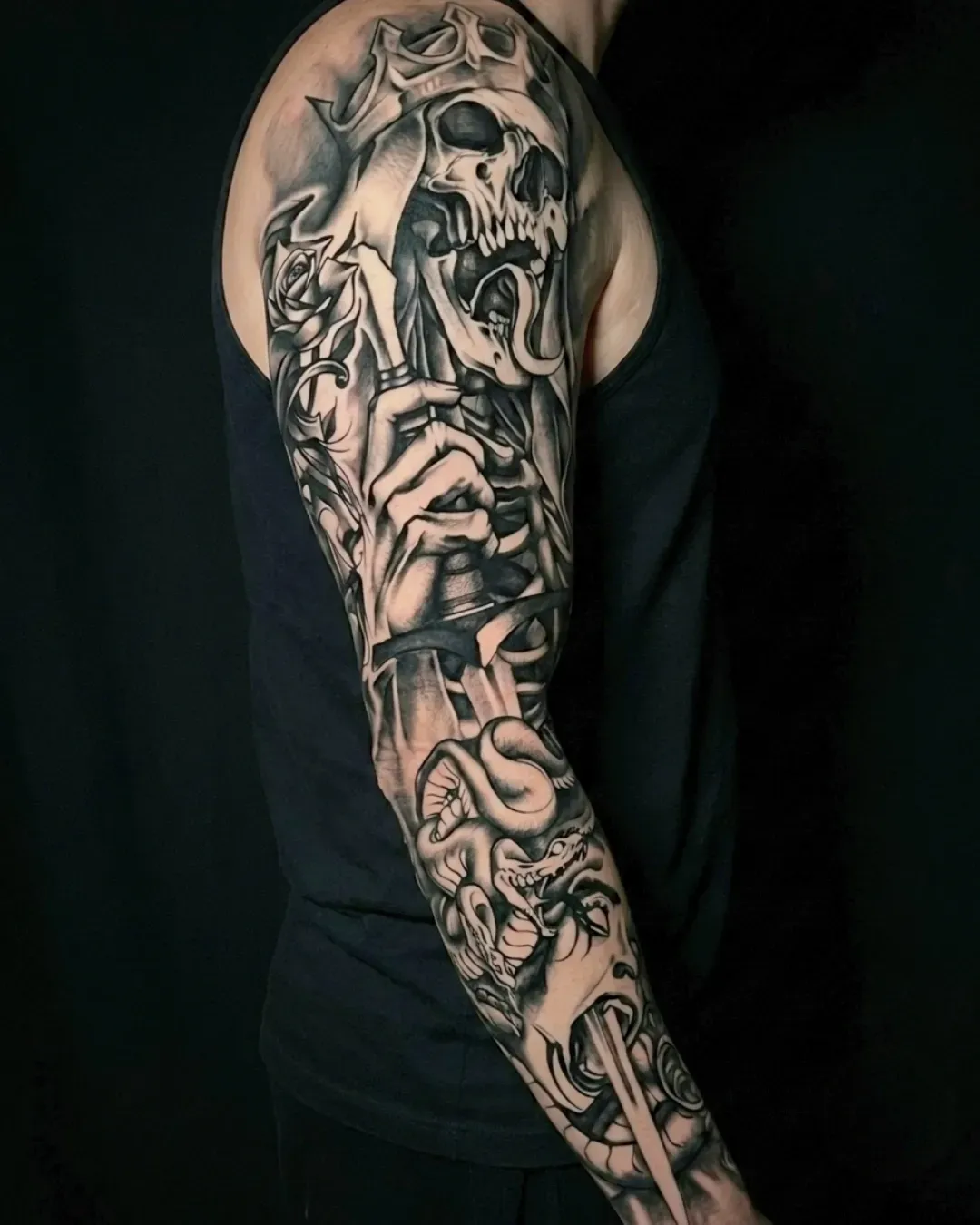  black work tattoo of a skeletal Lich king, holding a sword piercing through the head of Medusa done in Oceanside, California by the Saint