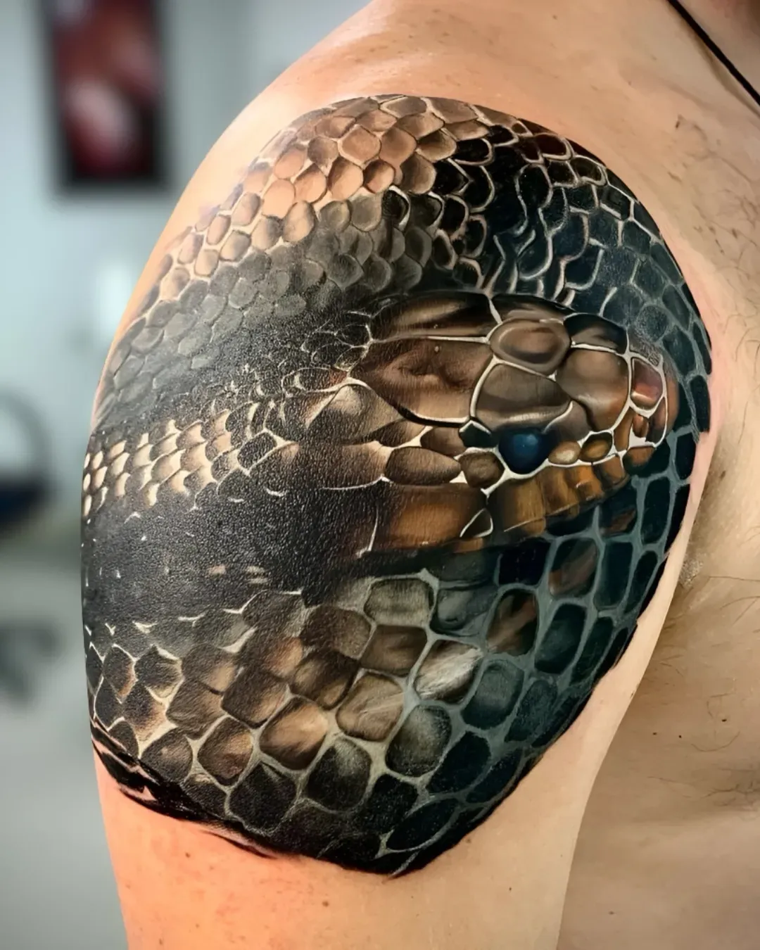  A hyper realism colored snake tattoo on the shoulder done by Alek the Saint  tattoo artist in Oceanside, California