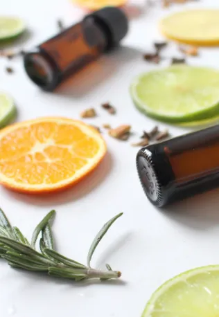 Fresh citrus slices, herbs, and essential oil bottles used in deodorizing treatments, highlighting the natural and effective deodorizing services by Right Now Cleaning Services in Sydney.