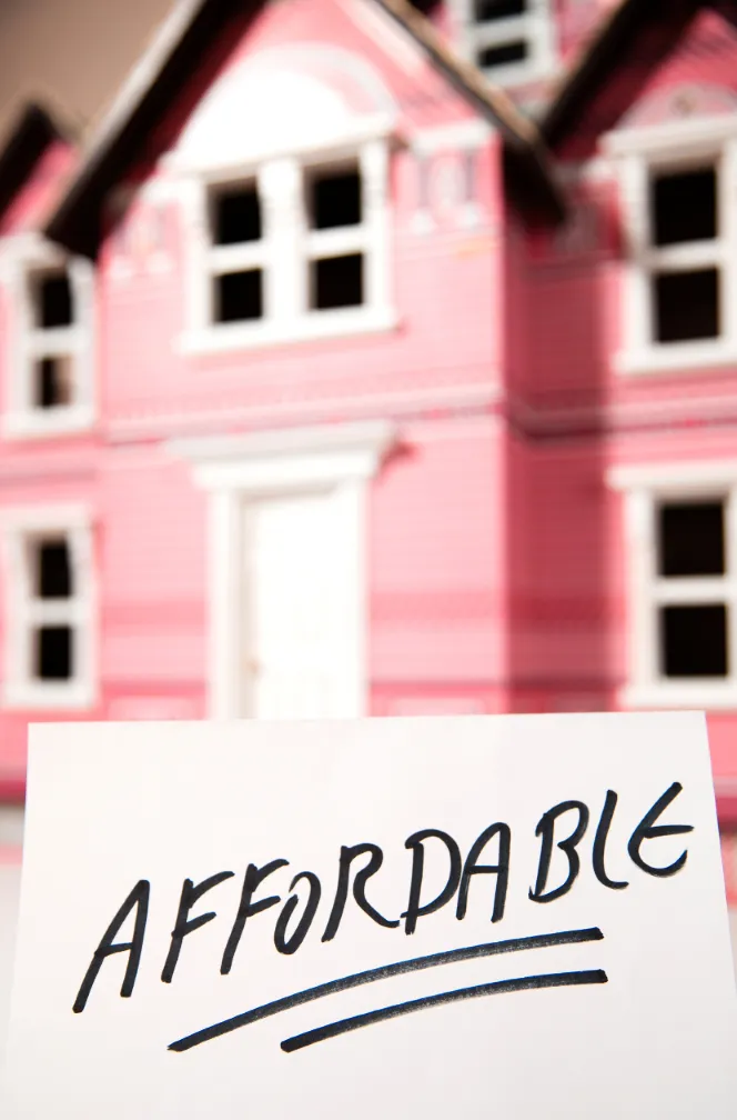 A sign reading "Affordable" with a blurred image of a house in the background, representing affordable painting services.