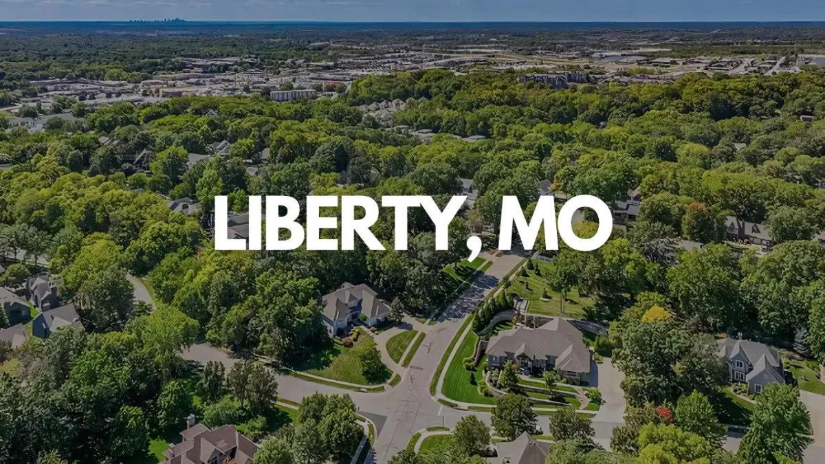 Aerial view of residential neighborhood surrounded by trees in Liberty, Missouri