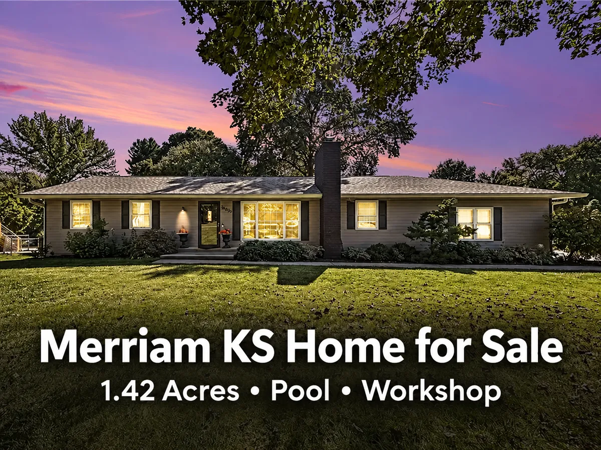  Merriam KS home for sale at twilight with mature trees and a spacious lawn, featuring 1.42 acres, a pool, and a workshop.