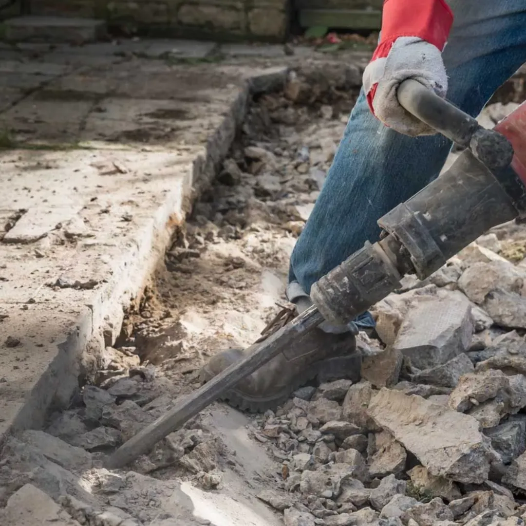 man holding camera with tripod during daytime