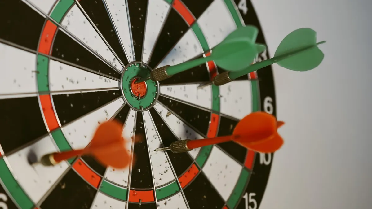 Dart board with a dart hitting the bullseye, symbolizing the precision and targeted financial planning offered by Indexed Universal Life Insurance.